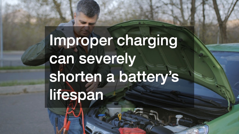 man preparing to charge a car battery